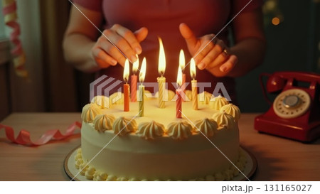 Vintage 1970s Birthday Celebration Hands Blowing Out Candles on Cake 131165027