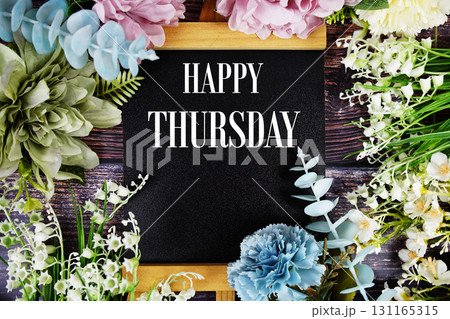 Happy Thursday text with flowers bouquet decoration on wooden background Happy Thursday text with flowers bouquet decoration on wooden background 131165315