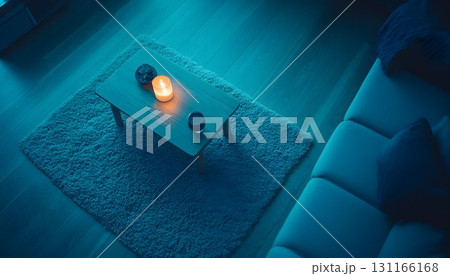 Dimly lit room with candle on coffee table cozy home interior 131166168