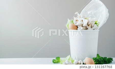 Food waste bin filled with chicken bones and vegetables, concept of waste management, background 131167768