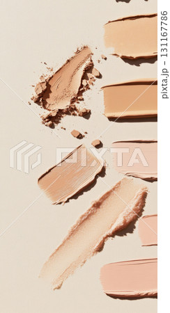 Fluid cosmetics textures featuring spread highlighter and foundation cream 131167786