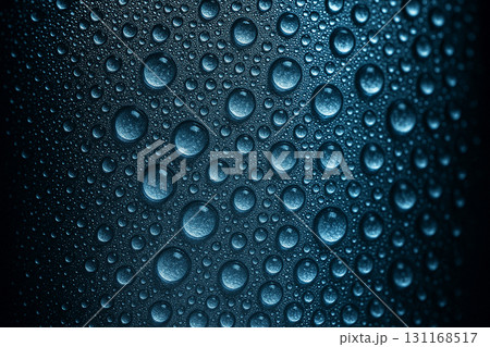 Macro close up of dark blue water droplets densely covering a textured background under uneven lighting. Wallpaper and design concept. Macro close up of dark blue water droplets densely covering a textured background under uneven lighting. Wallpaper and design concept. 131168517