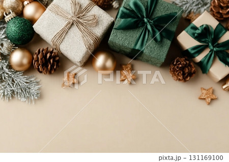 Express your affection this holiday season with charming presents. Top view shot of elegant gift boxes, frosty fir twigs, christmas balls, cones, stars on beige background with ad panel Express your affection this holiday season with charming presents. Top view shot of elegant gift boxes, frosty fir twigs, christmas balls, cones, stars on beige background with ad panel 131169100
