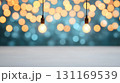 Warm glowing light bulbs hanging against blurred bokeh background create cozy atmosphere, perfect for festive occasions or intimate gatherings 131169539