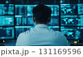 professional observing data on multiple screens in modern office environment, showcasing technology and analytics 131169596