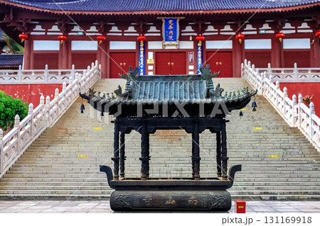 Hainan Island, Sanya: Nanshan Buddhist Center. View of the incense burner in front of the Temple Hainan Island, Sanya: Nanshan Buddhist Center. View of the incense burner in front of the Temple 131169918