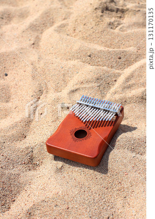Kalimba on sandy beach Kalimba on sandy beach 131170135