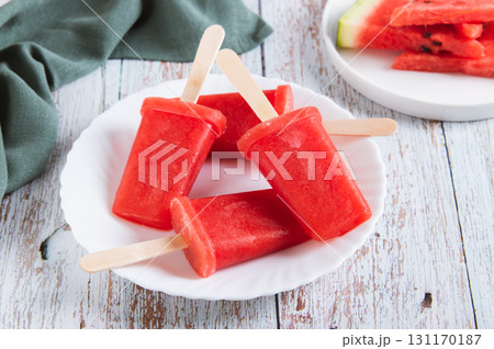 Red watermelon popsicle ice cream on a plate on the table 131170187