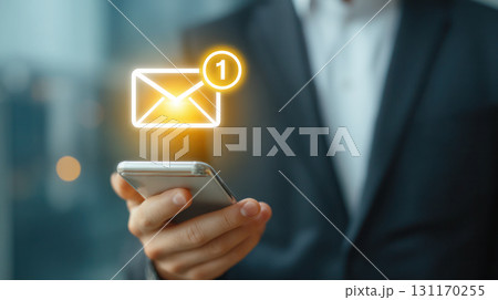 Businessman holding smartphone with email notification icon, showcasing modern communication technology in a professional environment with blurred background Businessman holding smartphone with email notification icon, showcasing modern communication technology in a professional environment with blurred background 131170255