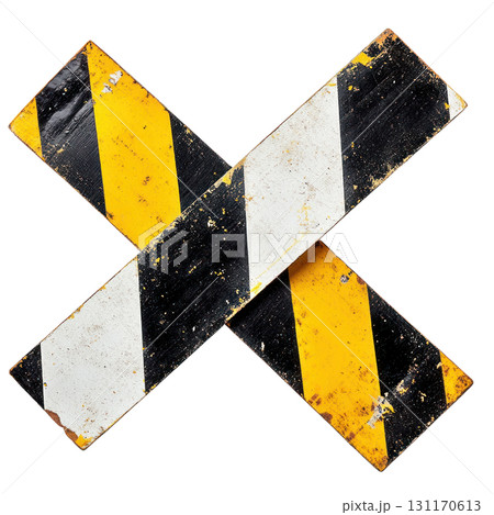 Cautionary traffic sign with black and yellow stripes creating an X shape indicating hazard on road 131170613