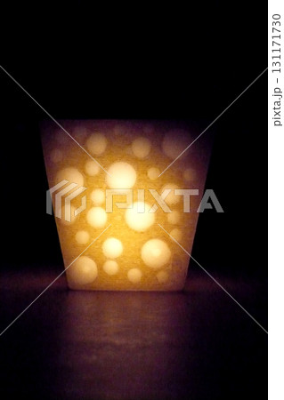 candle in the shape of yellow cheese shine with a fire light candle in the shape of yellow cheese shine with a fire light 131171730