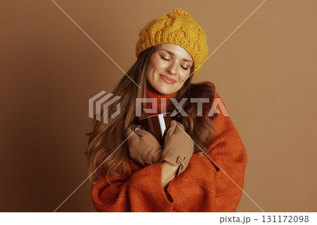 Woman Holding Mug to Chest with Closed Eyes Woman Holding Mug to Chest with Closed Eyes 131172098