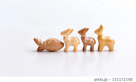 Eco-friendly wooden animal toys handcrafted with visible wood grain, isolated on white background for sustainable design. Eco-friendly wooden animal toys handcrafted with visible wood grain, isolated on white background for sustainable design. 131172198