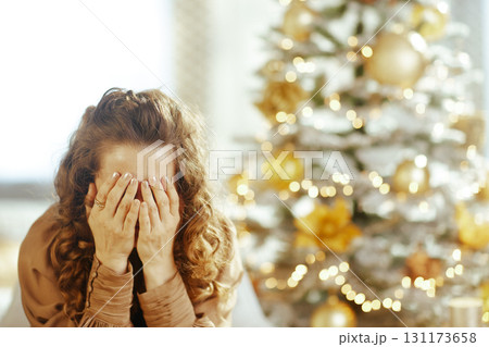 Woman\'s Melancholy Overwhelm During Holiday Season 131173658
