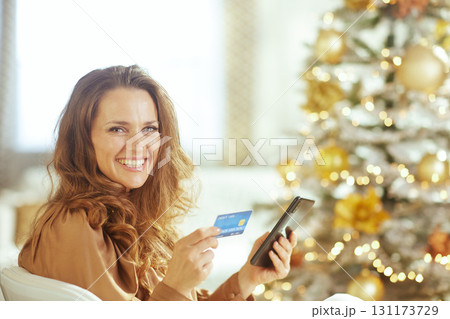 Woman with Tablet and Credit Card for Holiday Shopping Woman with Tablet and Credit Card for Holiday Shopping 131173729