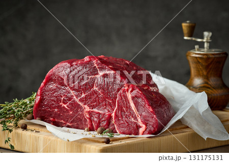 fresh raw beef meat with herbs and spices fresh raw beef meat with herbs and spices 131175131