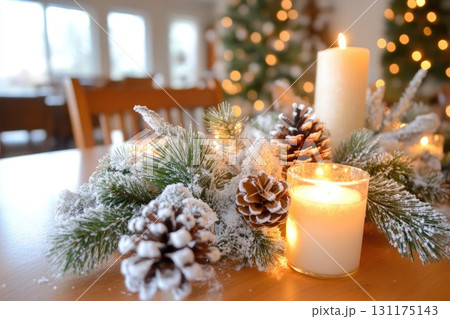 Festive holiday table setting with candles and pinecones in cozy winter atmosphere Festive holiday table setting with candles and pinecones in cozy winter atmosphere 131175143