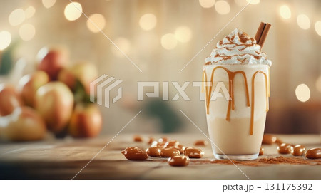 Creamy caramel apple milkshake with whipped cream and cinnamon stick 131175392