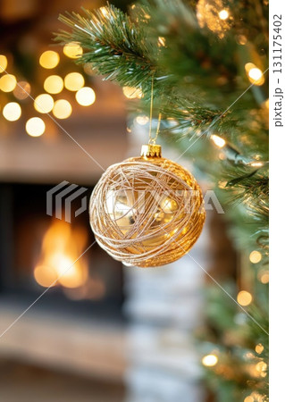 Cozy holiday scene with christmas ornament reflecting warm fireplace ambiance 131175402