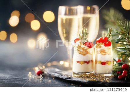 Festive holiday appetizers with sparkling wine and decorative garnishes for celebratory gatherings 131175440