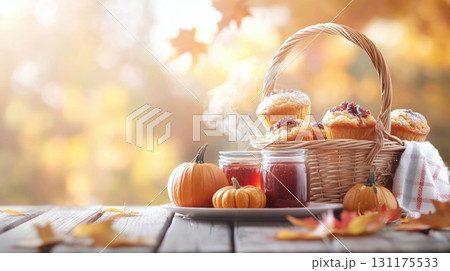 Autumn harvest gathering: cozy breakfast with warm drinks and fresh pastries in fall setting 131175533