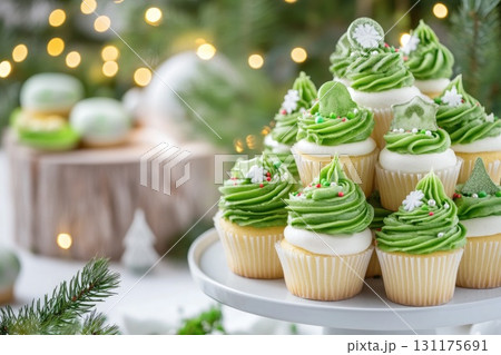 Festive cupcake christmas tree with green icing and holiday decor Festive cupcake christmas tree with green icing and holiday decor 131175691