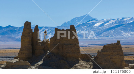 Successful woman hiker taking photo wiith Mount Everest in Tibet, China 131176800