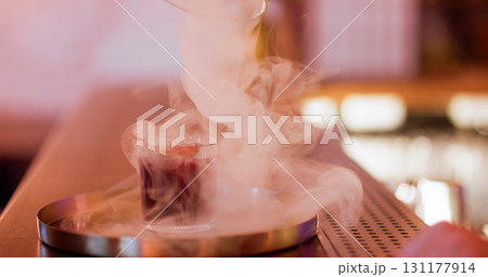 Cocktail smoke defocused. Serving drink. Glass with aroma beverage in swirling fume cloud. Pub modern technique presenting alcohol. 131177914