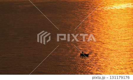 beautiful golden ocean view with boat in the morning beautiful golden ocean view with boat in the morning 131179176