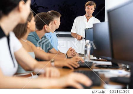 Male teacher enthusiastically explains 131181592