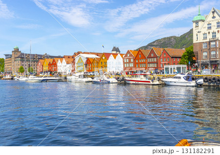 Bergen, Norway - June 11, 2022 : A row of old Hanseatic commercial buildings in Bryggen, Norway on June 11,2022. Bergen, Norway - June 11, 2022 : A row of old Hanseatic commercial buildings in Bryggen, Norway on June 11,2022. 131182291