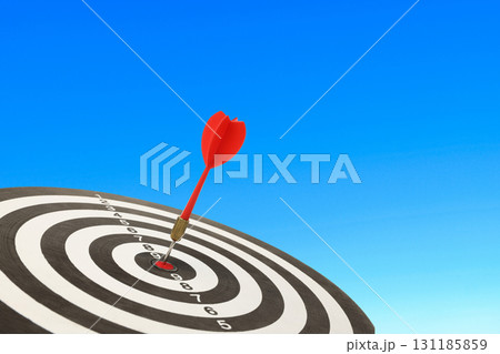 Dart strikes the center of a bullseye demonstrating precision 131185859