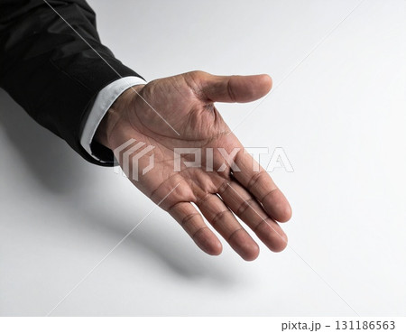 Businessman Hand Reaching Out with Open Palm 131186563