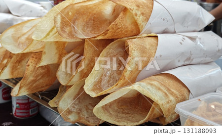 Crispy roti dressing with sweetened condensed milk. 131188093