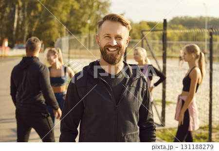 Portrait of smiling man looking at camera after sport fit exercises in the park 131188279