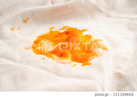 Dirty tomato sauce stain or ketchup on cloth. 131189608