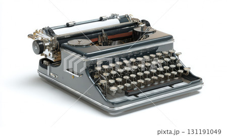 A vintage grey typewriter with paper in it on a white background A vintage grey typewriter with paper in it on a white background 131191049