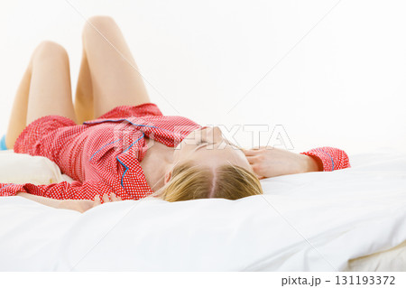 Woman sleeping in bed on back Woman sleeping in bed on back 131193372