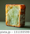 Slice of bread with a white filling is shown 131193599