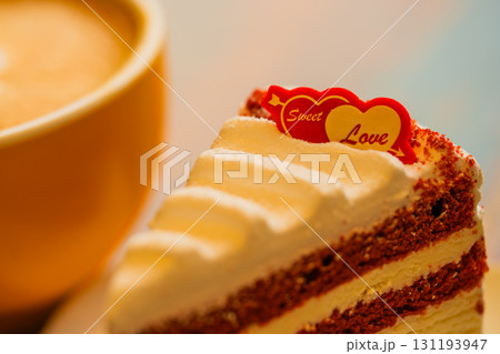Homemade cake Red Velvet decorated with cream and cup of coffee 131193947