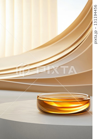 serene glass bowl filled with amber liquid rests on minimalist surface, surrounded by soft, curved architectural elements. warm tones create tranquil atmosphere serene glass bowl filled with amber liquid rests on minimalist surface, surrounded by soft, curved architectural elements. warm tones create tranquil atmosphere 131194456