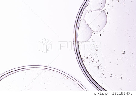 Cosmetic moisturizing gel or skin serum in a petri dish. Copy space 131196476