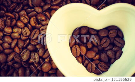 Heart shaped cup on coffee background 131196629