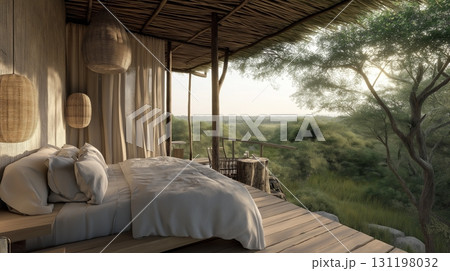 Safari lodge bedroom with panoramic view of elephants grazing in grassy savanna. 131198032