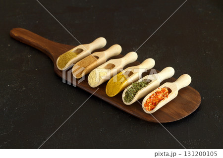 Big set of Indian spices on wooden table. Top view, Horizontal image. 131200105