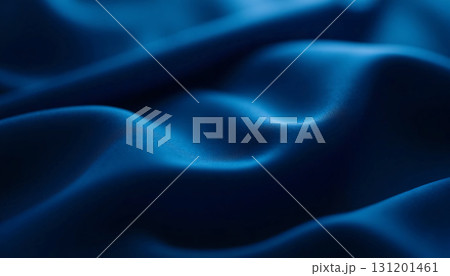 Luxurious blue fabric showcases intricate folds and soft waves, illuminated by delicate lighting that enhances its rich texture and depth, inviting touch and admiration Generative AI 131201461