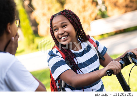 African american teens spending time together and looking contented 131202203