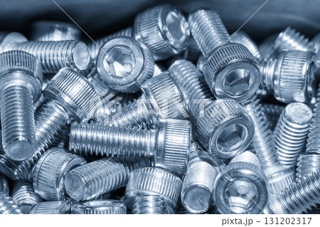 The  pile of hexagon socket head screw cap in the light blue scene. 131202317