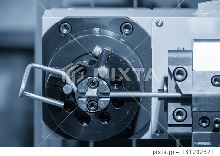 The steel wire forming machine in the light blue scene. 131202321