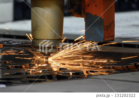 Close up scene the fiber laser cutting machine cut the metal plate control by CNC program. 131202322